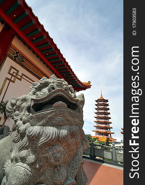 Chinese Bronze Lion Statue At A Pagoda Temple