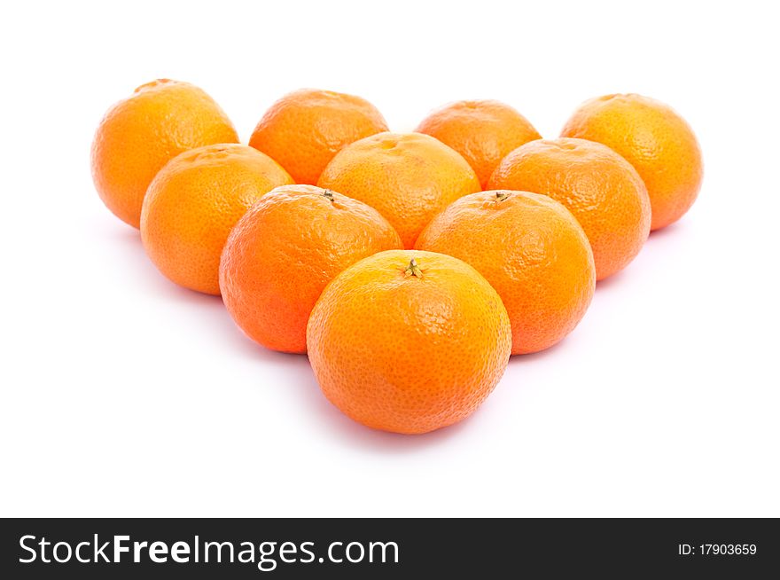 A pyramid of fresh tangerines isolated on white background