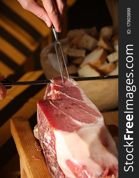 Hand slicing karst dried ham. Hand slicing karst dried ham