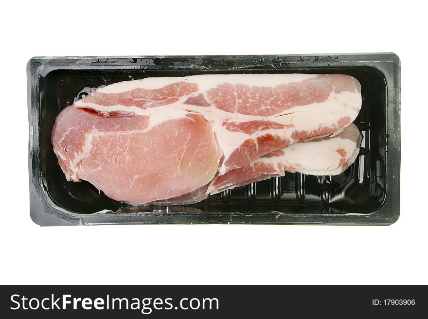 Tray of raw back bacon rashers isolated on white