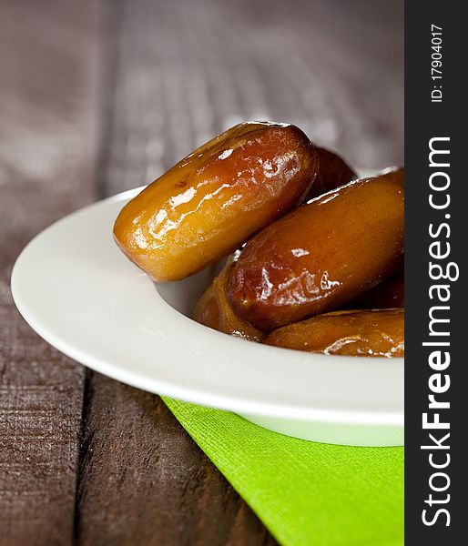 Dried dates in a bowl closeup