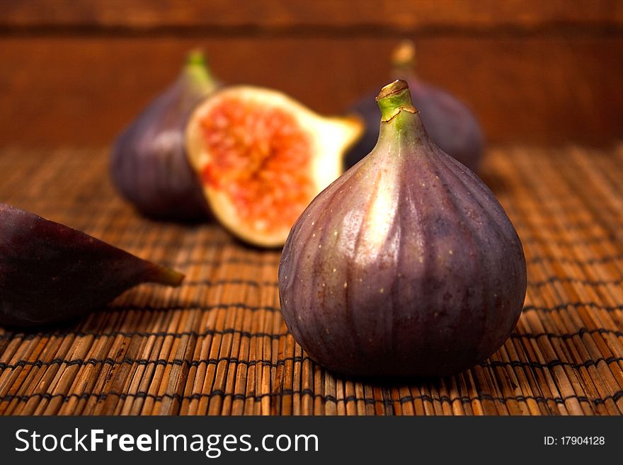 Ripe figs on rural background