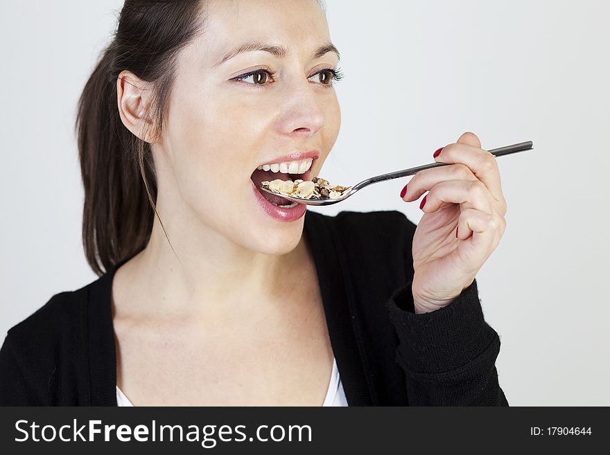 Woman eating cereals and muesli. Woman eating cereals and muesli