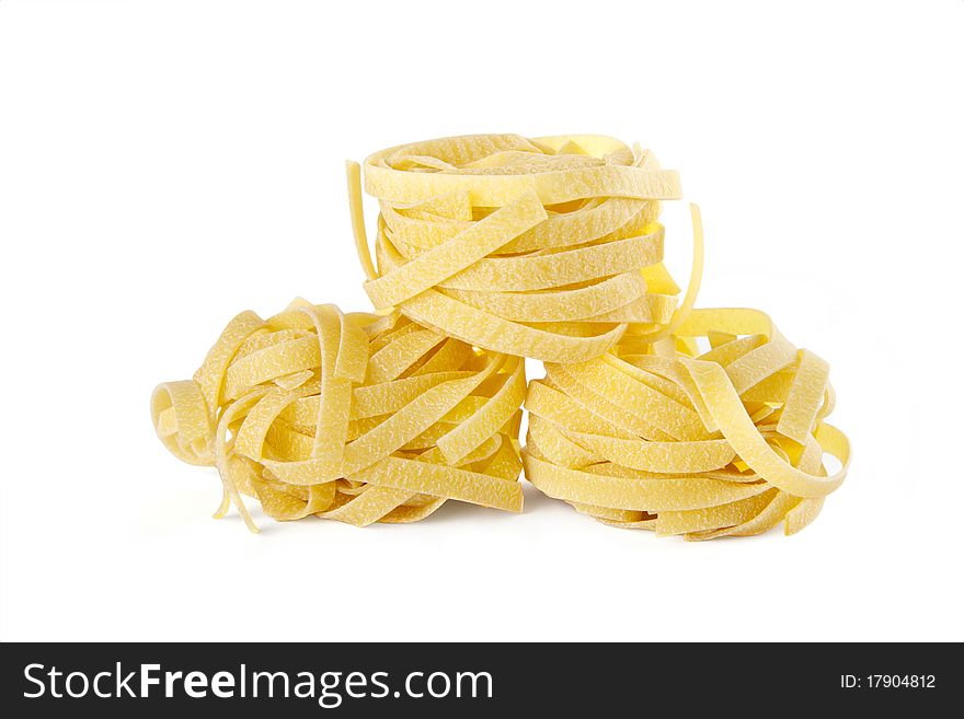 Vermicelli pasta nests on white