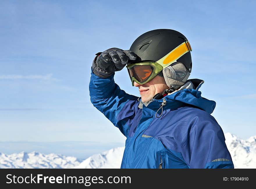 Man looking at the horizon in snowy mountains