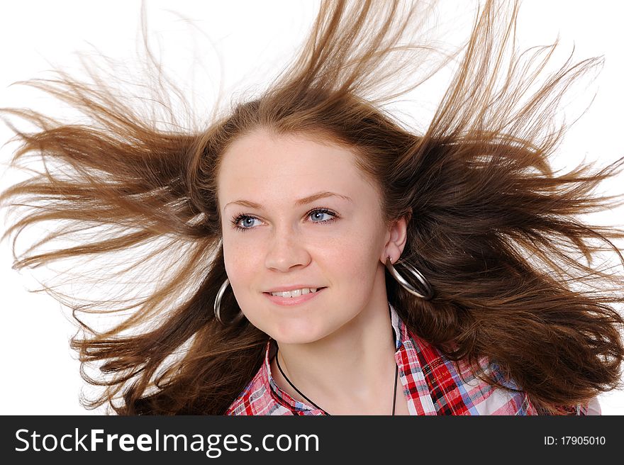 Girl with hair fluttering in the wind. On a white background