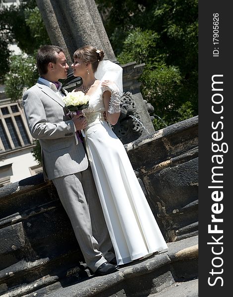 Young beautiful wedding pair the man and the woman bouquet