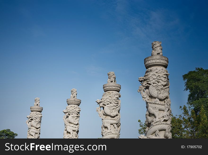 Totem pole with lion and dragon,China. Totem pole with lion and dragon,China.