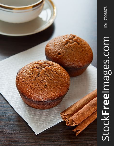 Close-up two chocolate muffins on a white placemat