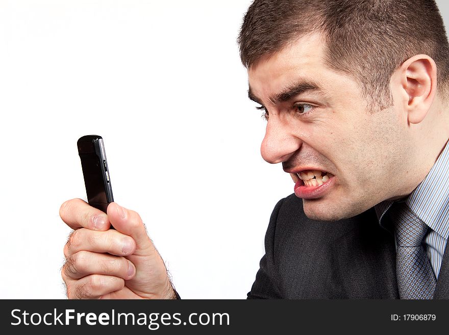 Stressed businessman screaming in telephone