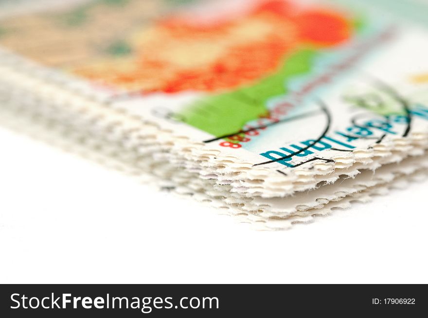 Macro of stamp perforations on white