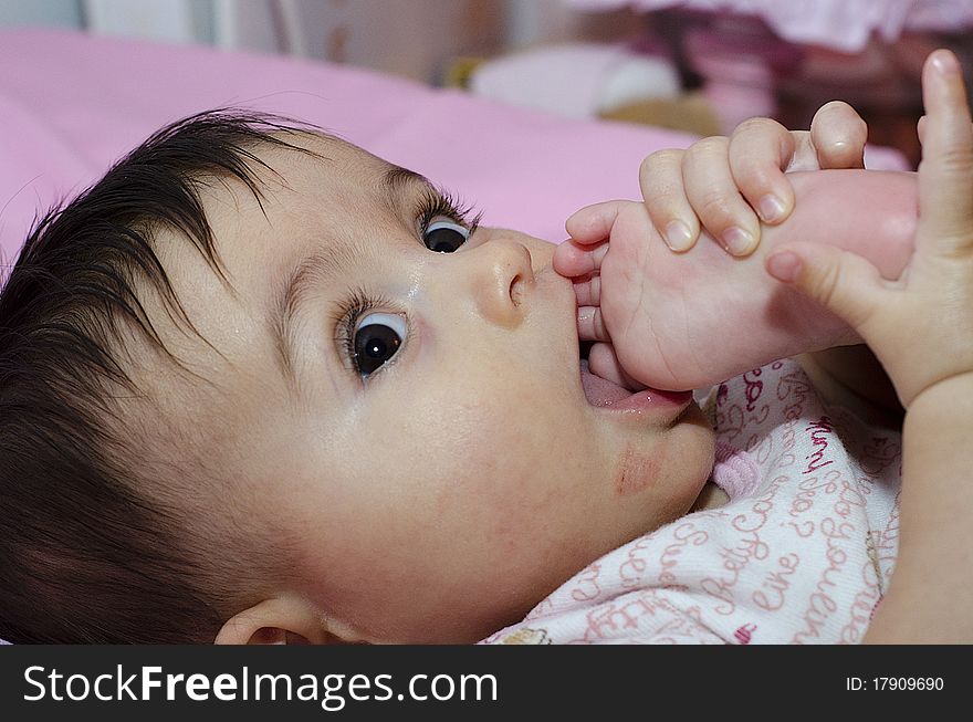 Baby Girl sucking her Toe, Italy