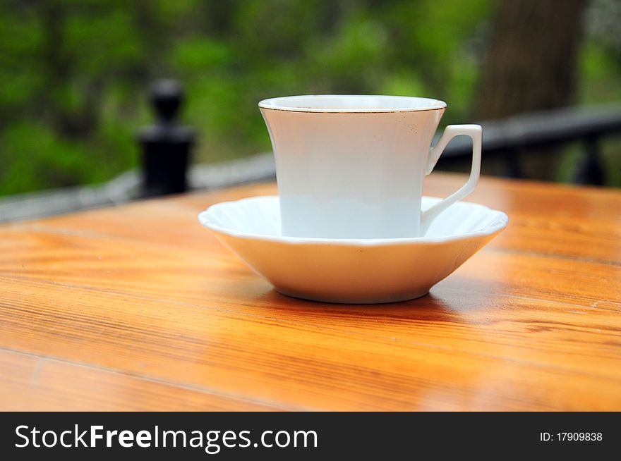 A cup of coffee on table. A cup of coffee on table