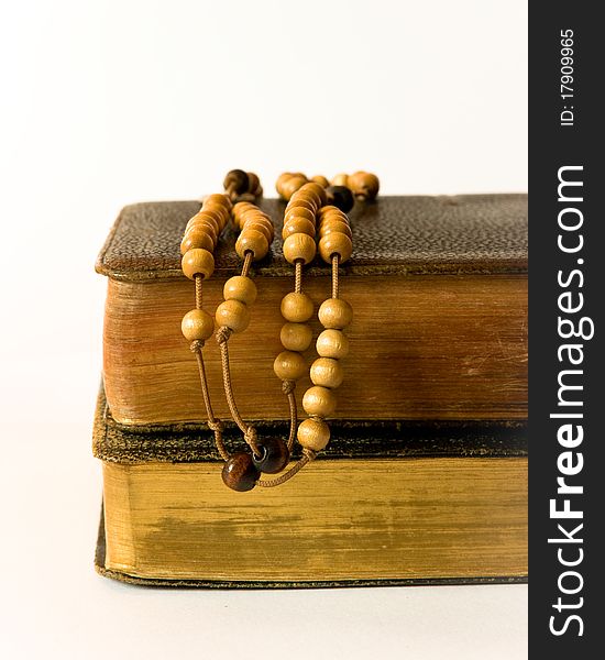 The book of Catholic Church liturgy and rosary beads. The book of Catholic Church liturgy and rosary beads