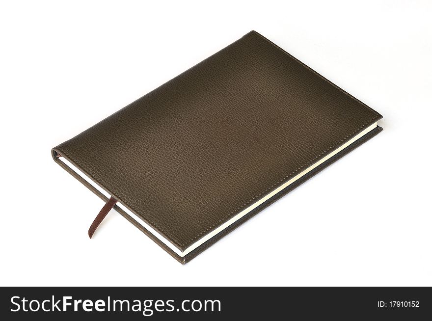 Dark brown leather notebook on white background.