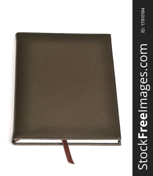 Dark brown leather notebook on white background.