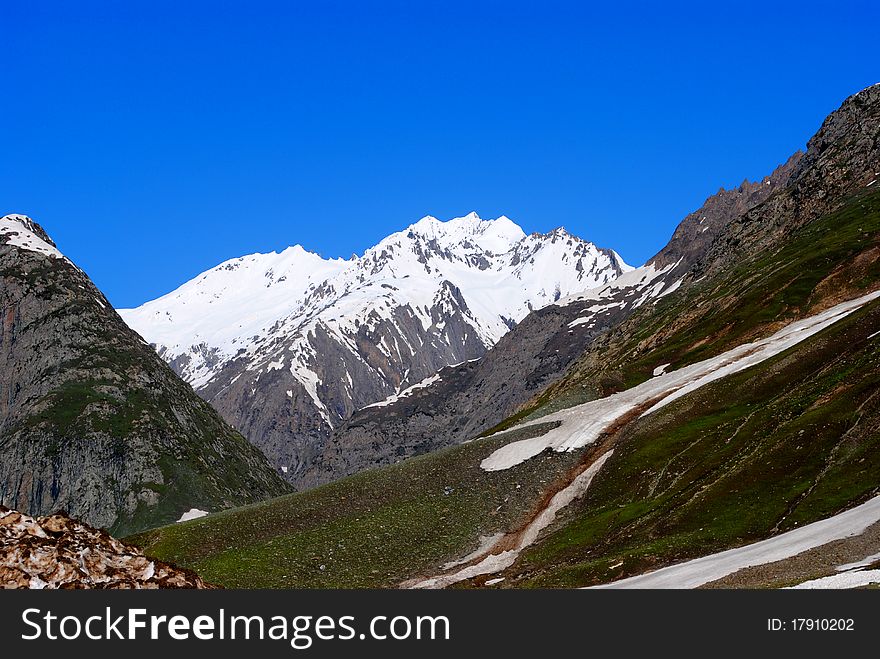 A beautiful landscape scene with glaciers and snow peaks. A beautiful landscape scene with glaciers and snow peaks.