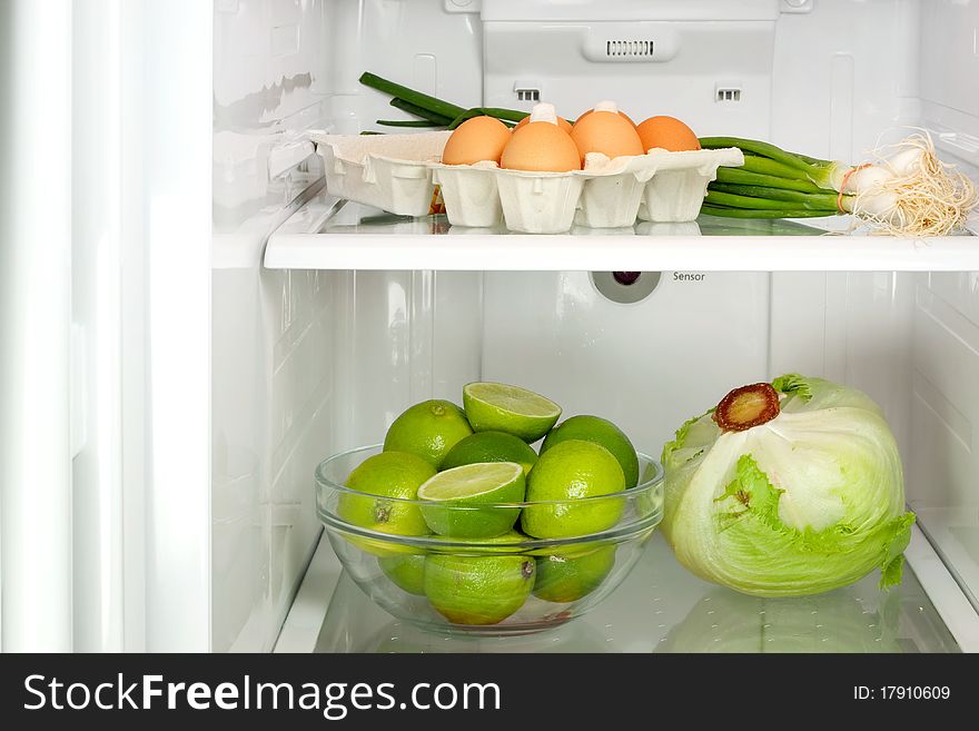 Open refrigerator with healthy food