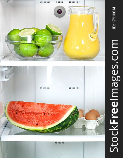 Refrigerator with some kinds of food - fruits, juice and eggs. Refrigerator with some kinds of food - fruits, juice and eggs