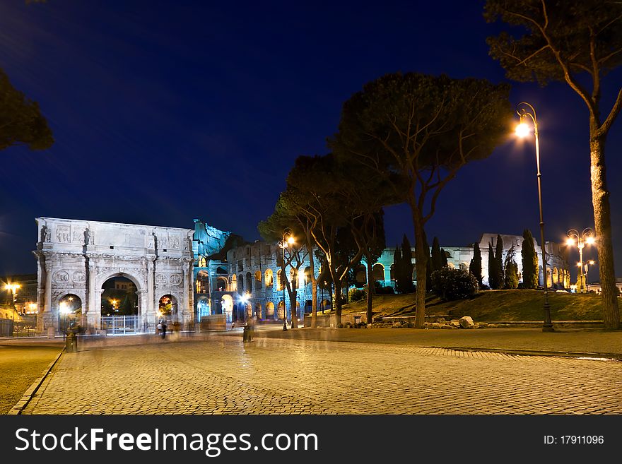 The Colosseum and the Arch of Constantine at night. The Colosseum and the Arch of Constantine at night