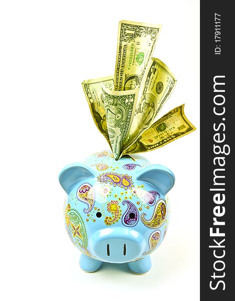 Colorful pig bank with money on a white buckground