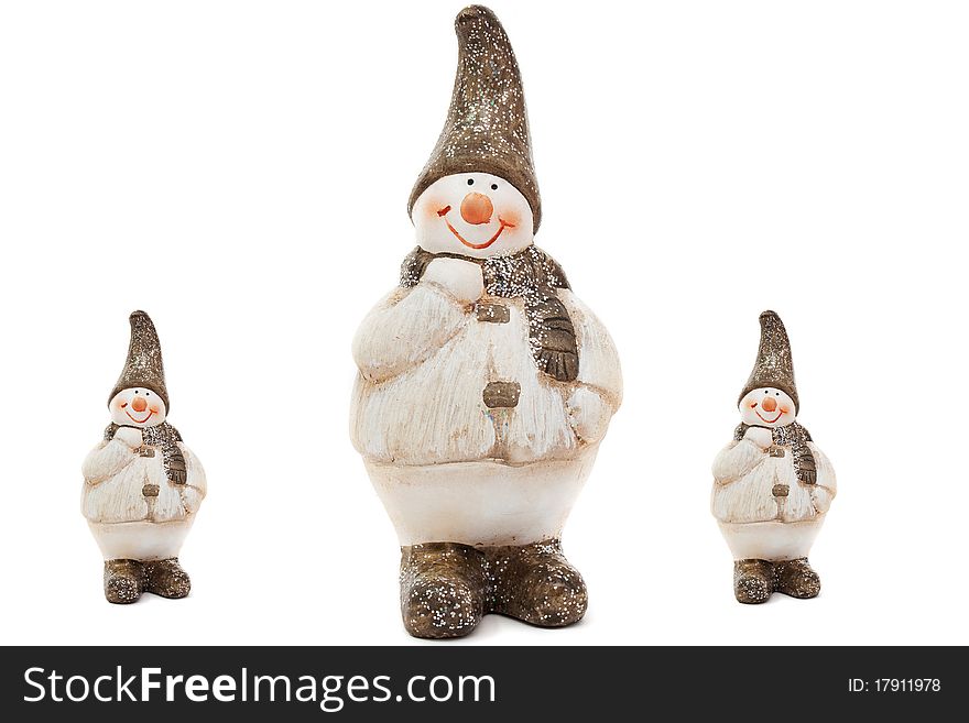 Three ceramic snowman on a white background. Three ceramic snowman on a white background