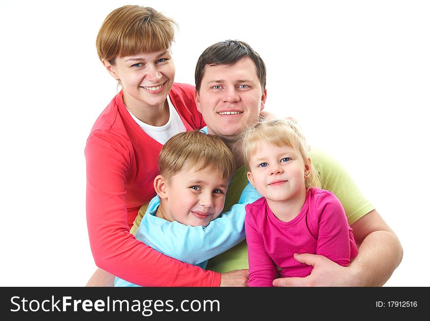 Portrait of siblings and their parents looking at camera. Portrait of siblings and their parents looking at camera