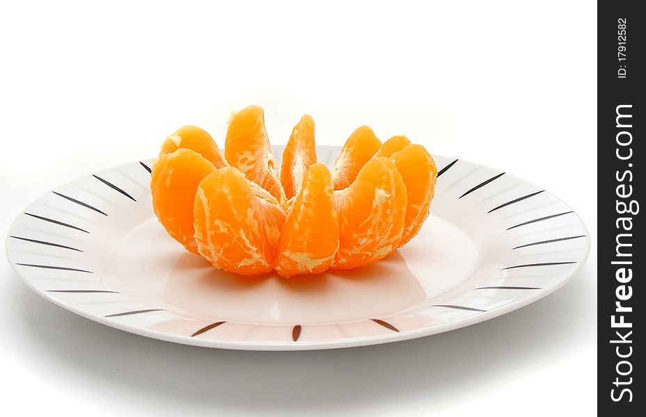 Plate with orange isolated on white background. Plate with orange isolated on white background