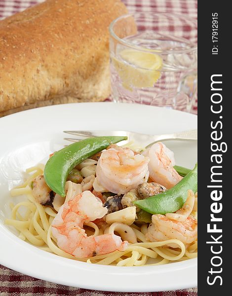Healthy seafood lunch or dinner tossed with al dente pasta. Healthy seafood lunch or dinner tossed with al dente pasta