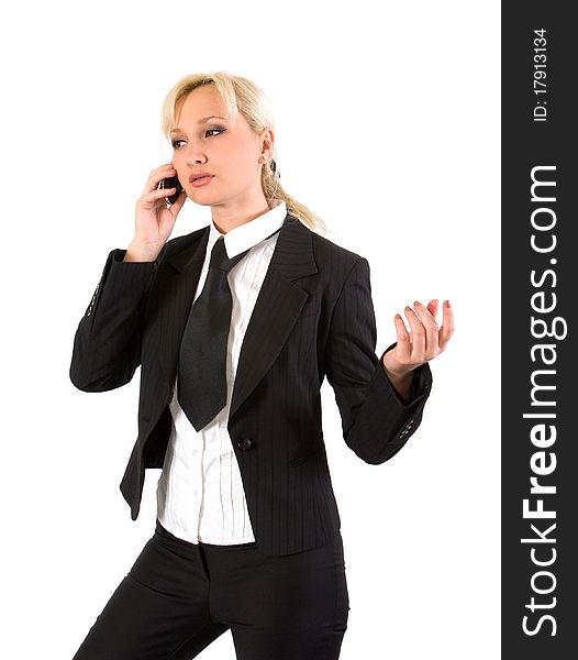 Girl in a business suit gestures while talking on a cell phone. Girl in a business suit gestures while talking on a cell phone.