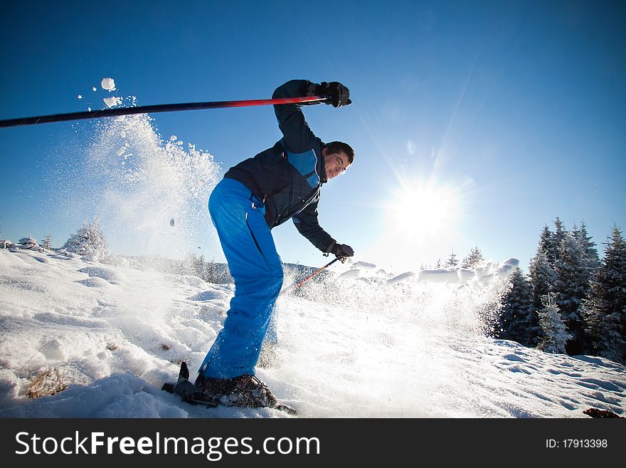 Man practising extreme ski on sunny day