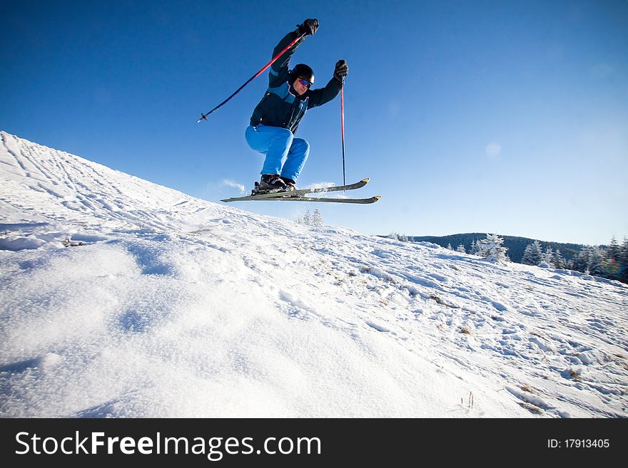 Man practising extreme ski on sunny day