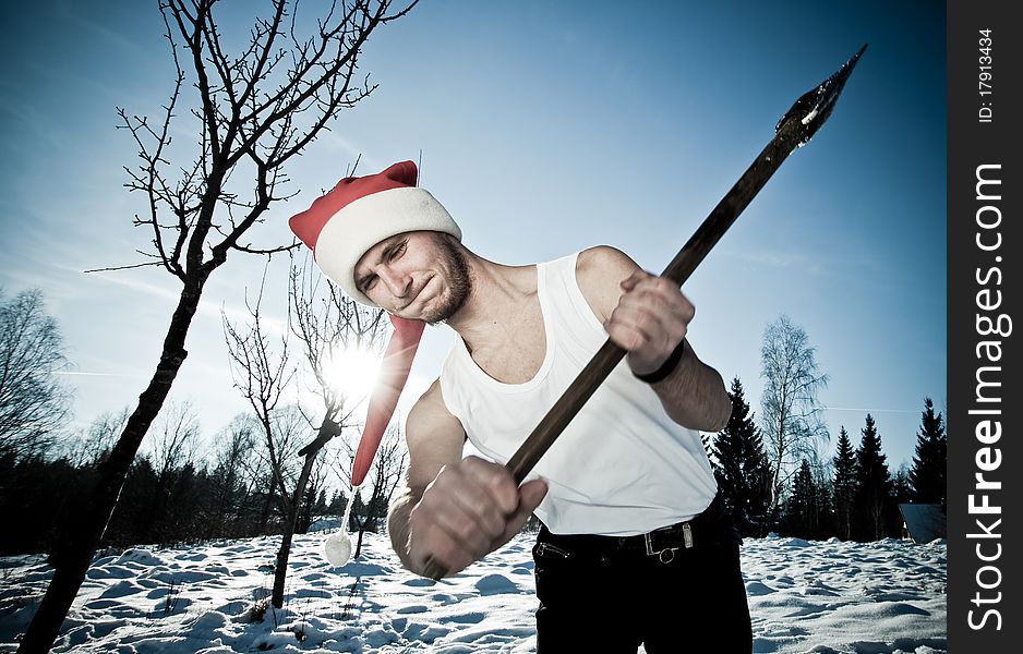 Furious Santa with an axe outside