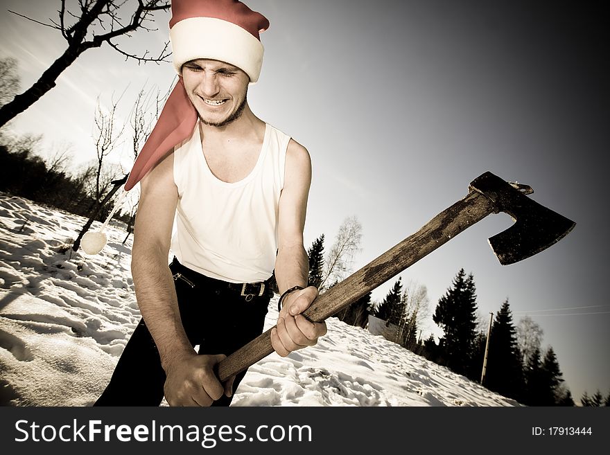 Furious Santa with an axe outside