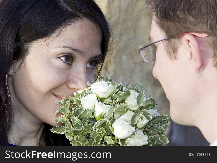 Romantic couple - woman with bouguet