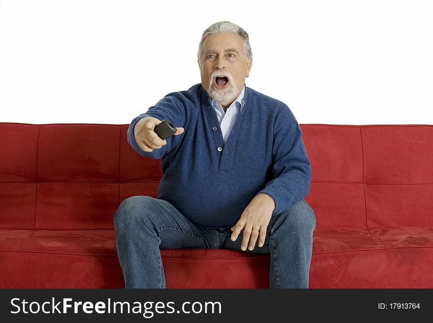 Old man on the sofa with television remote control