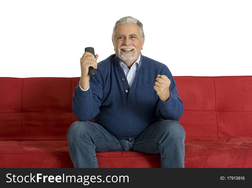 Old man on the sofa with television remote control