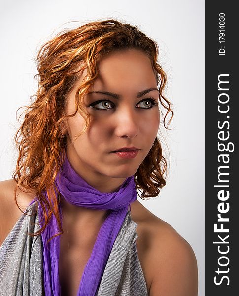 The portrait of brunette woman in the studio. The portrait of brunette woman in the studio