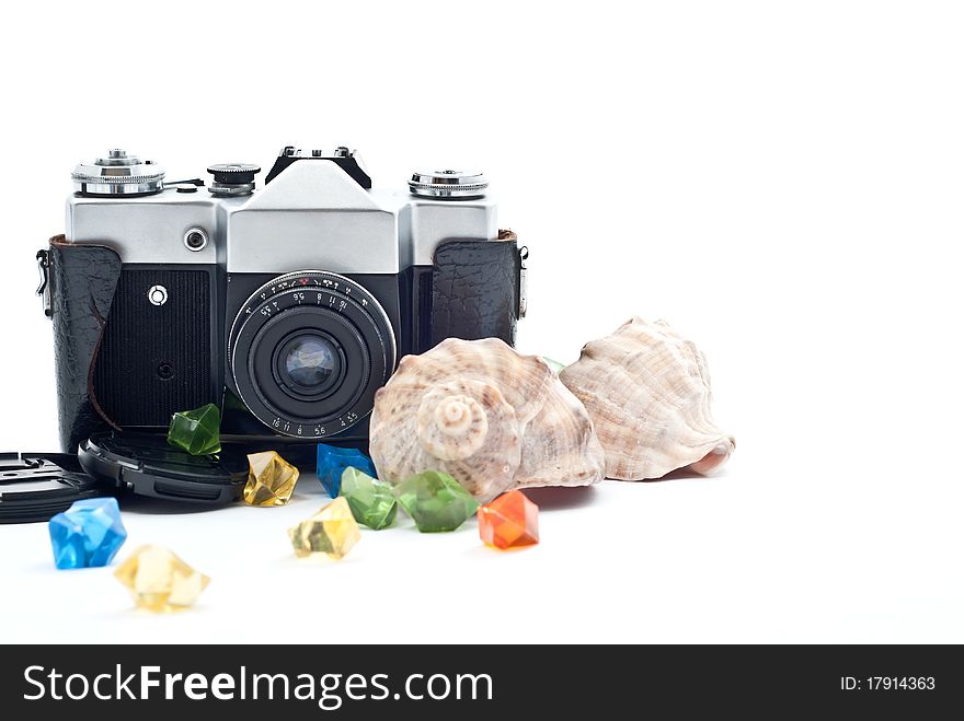 Black retro analog camera with lens. Isolated on white