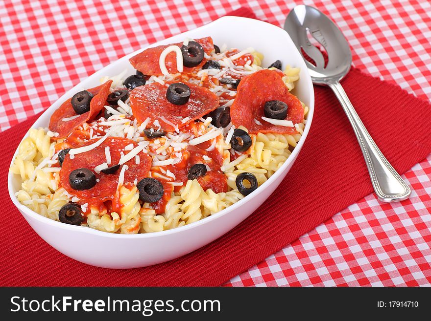 Pepperoni pasta with black olives and cheese