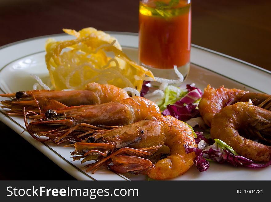 Fried shrimps, sause and salad on plate. Fried shrimps, sause and salad on plate