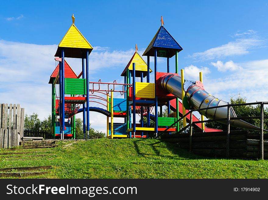 Colorful empty outdoor playground with big slide. Colorful empty outdoor playground with big slide