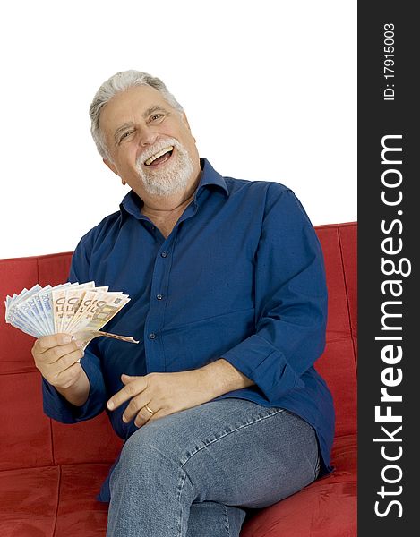 Elderly man on the couch with money in hand in a white background