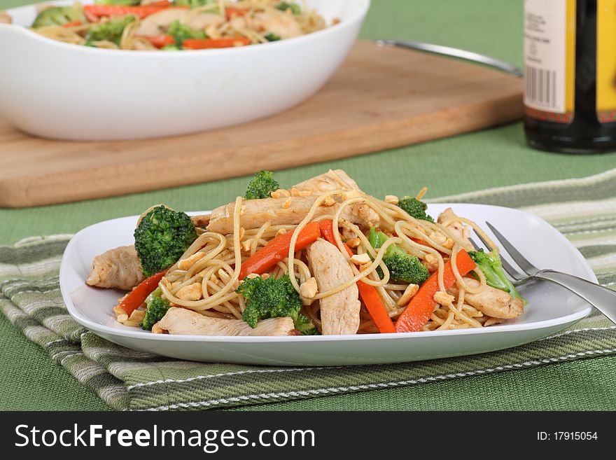 Chicken lo mein with carrots and broccoli. Chicken lo mein with carrots and broccoli