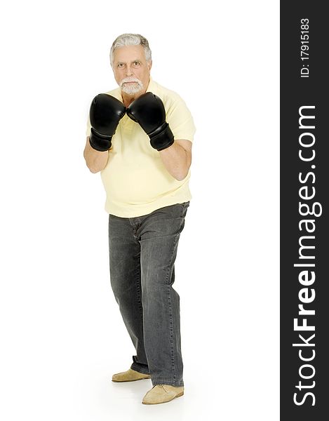 Elderly man with boxing gloves in a white background