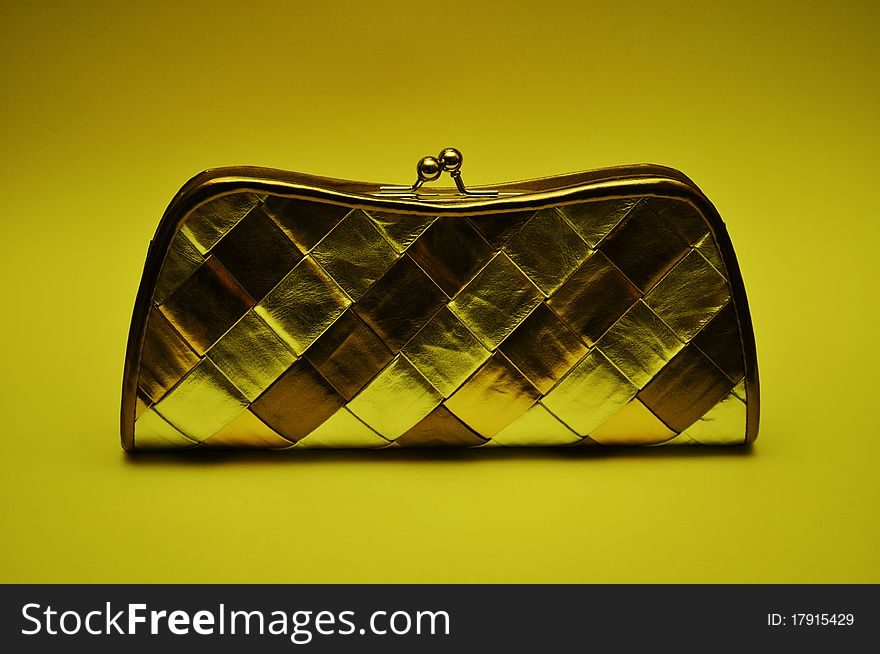 Luxurious fashion handbag, plaid wallet or purse, personal accessory, with closed clasp, multicolored, drawing of geometric shapes, metal. Luxurious fashion handbag, plaid wallet or purse, personal accessory, with closed clasp, multicolored, drawing of geometric shapes, metal