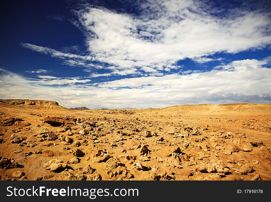 Landscape of the dessert and cloudy sky. Landscape of the dessert and cloudy sky