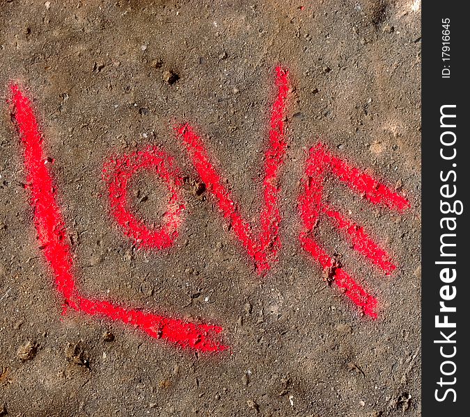 Word love written with crayon on concrete. Word love written with crayon on concrete