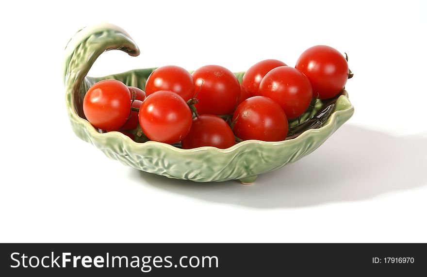 Cherry tomato --is a smaller garden variety of tomato, on a white background