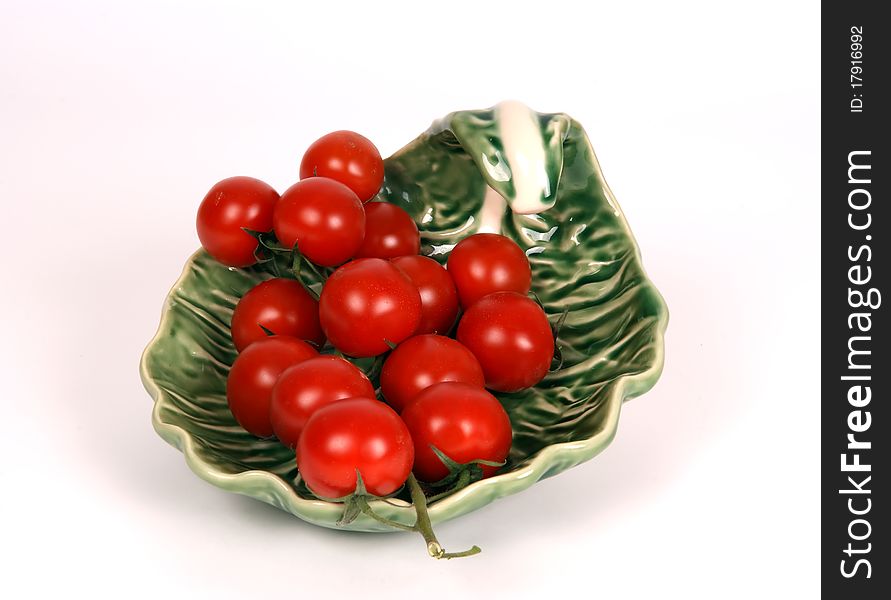 Cherry tomato --is a smaller garden variety of tomato, on a white background